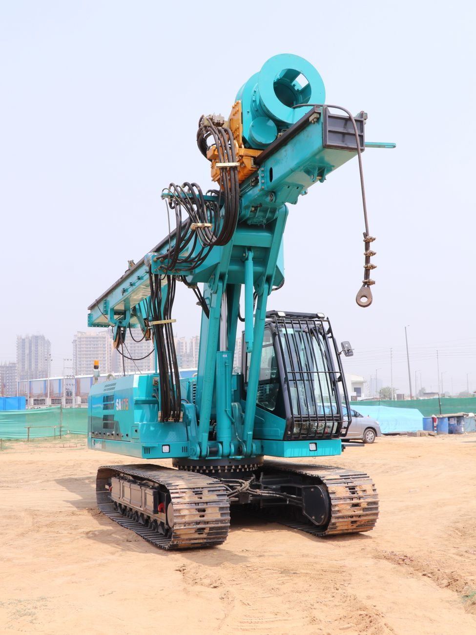 Piling rig standing on a levelled construction site ready to drive foundations