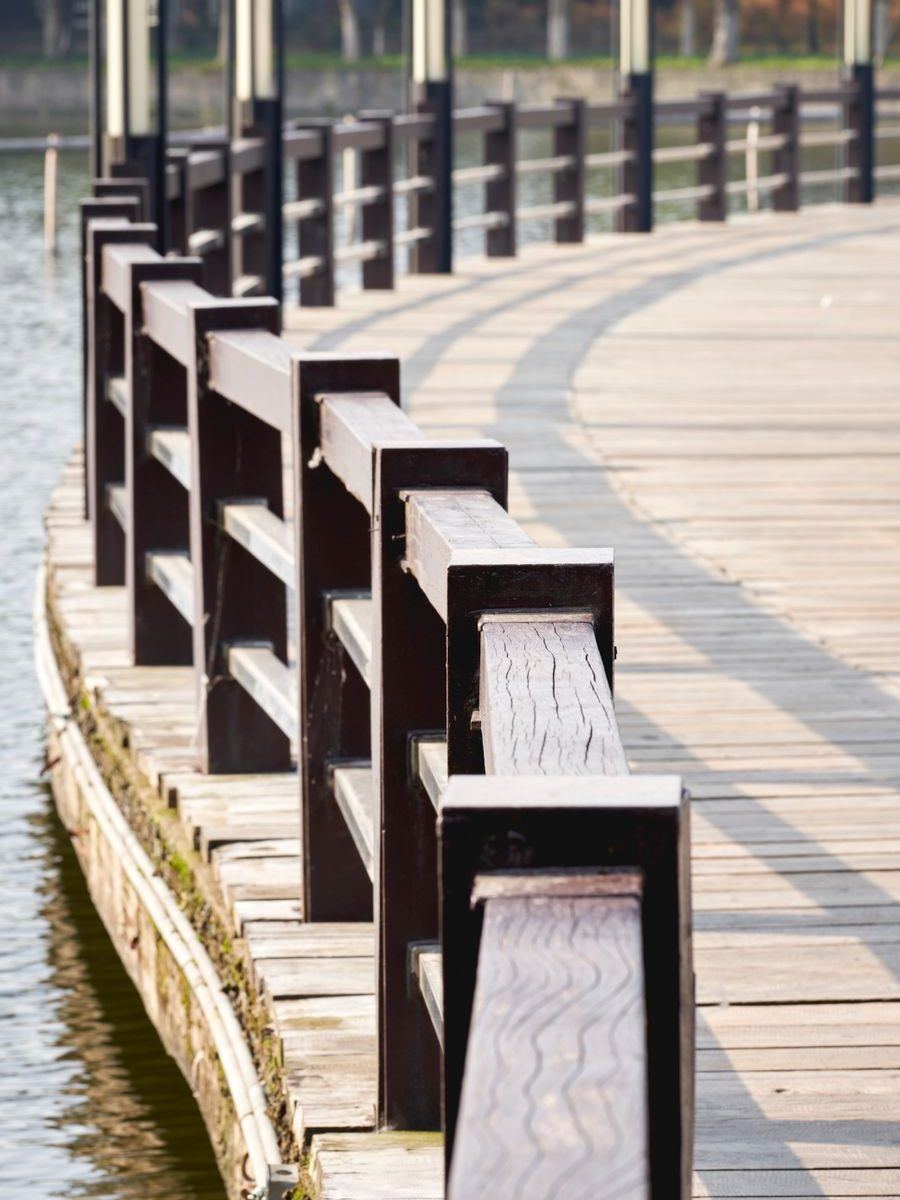 Timber railing posts curving away along a new boardwalk
