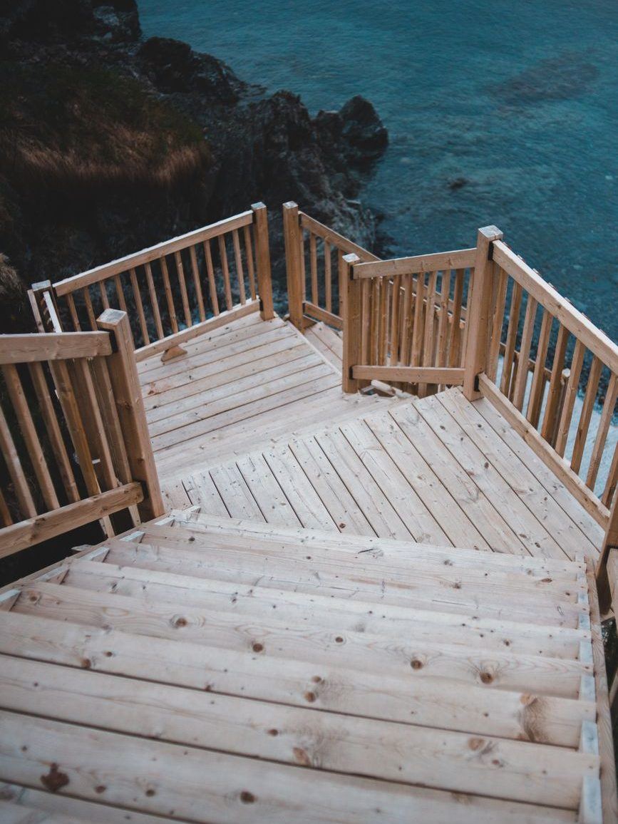 New timber steps and landing leading down toward the water below